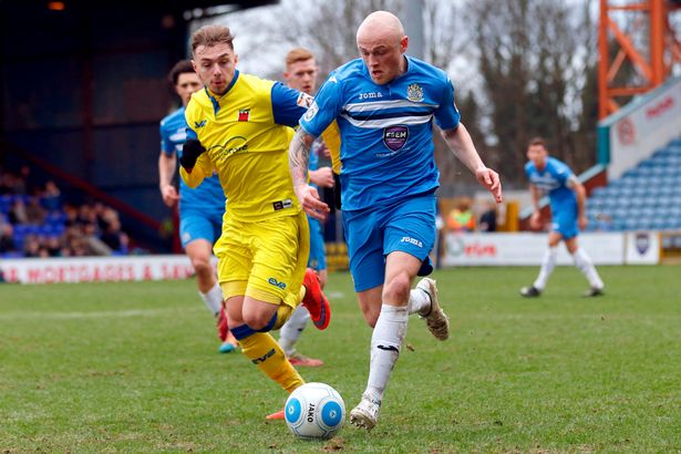 Halifax defender Sam Minihan in action for Stockport County